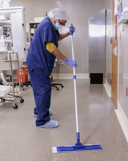 Pro Website - Operating Room EVS Worker Mopping Floor