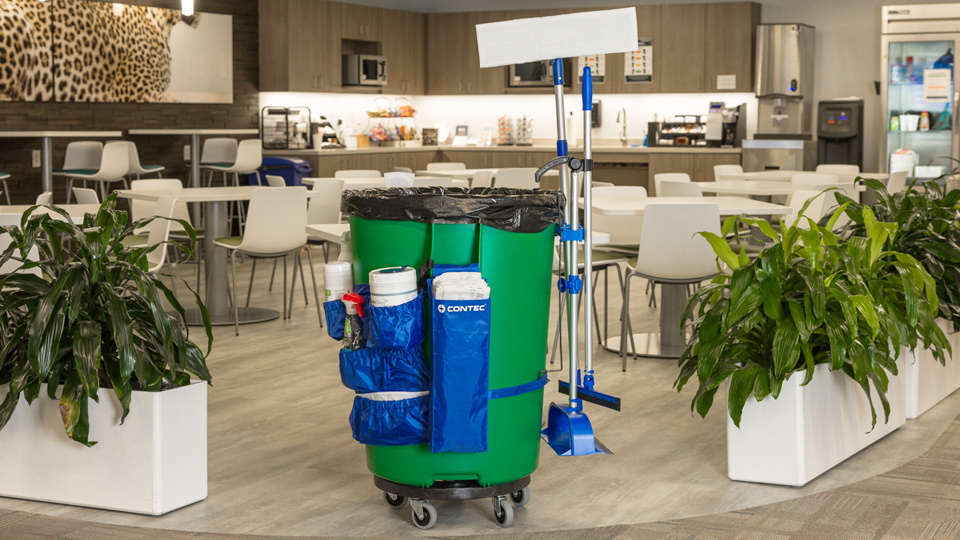 green trash can with Hardware and Parts attached to it for cleaning