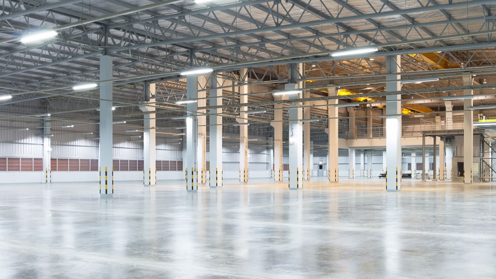 large empty warehouse with steel beams