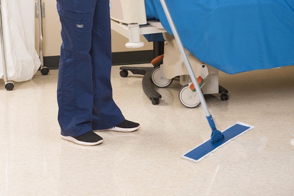 EVS workers cleaning hospital floor
